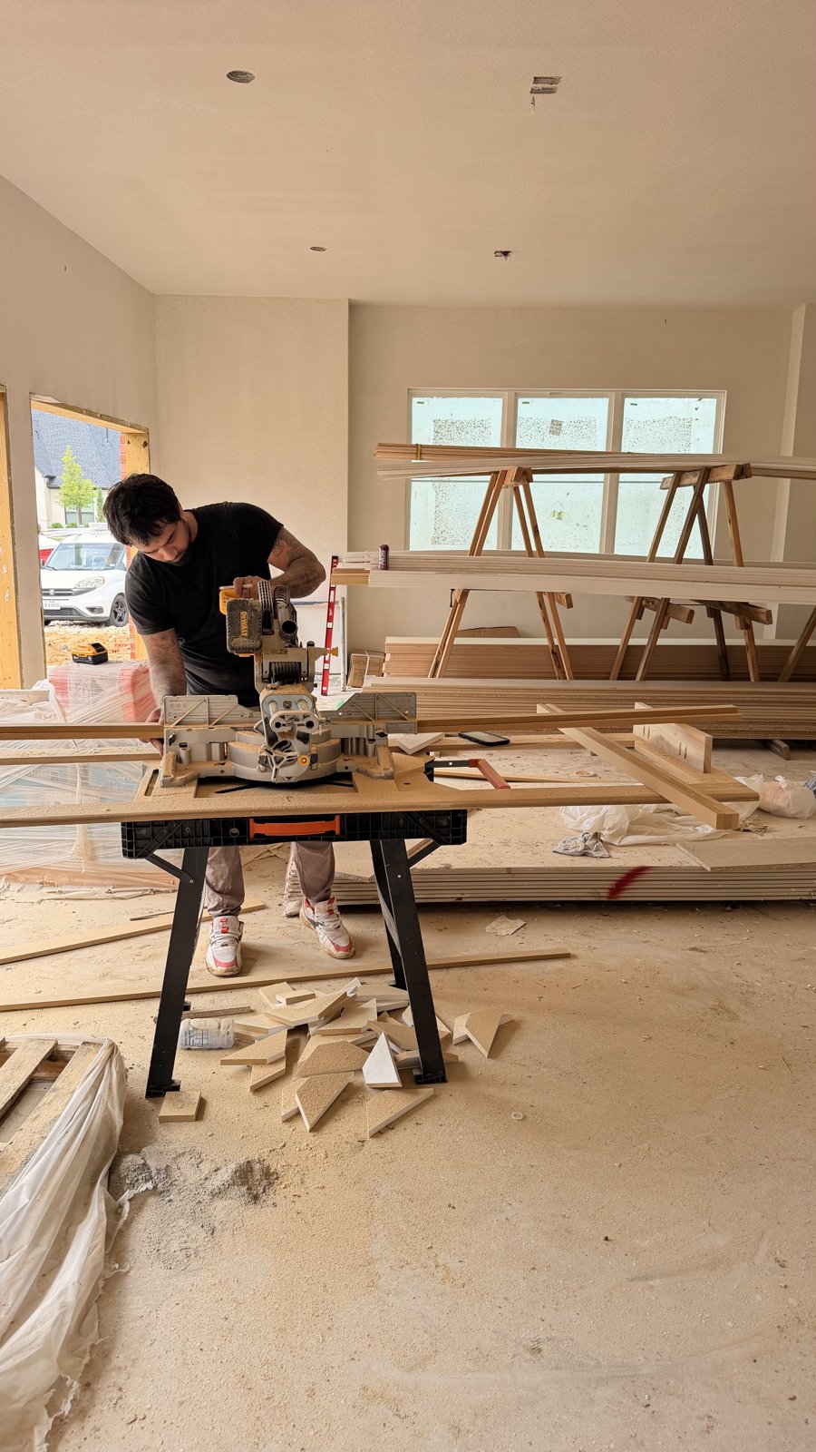 Abel crew cutting trim on a Chesmar-tier home